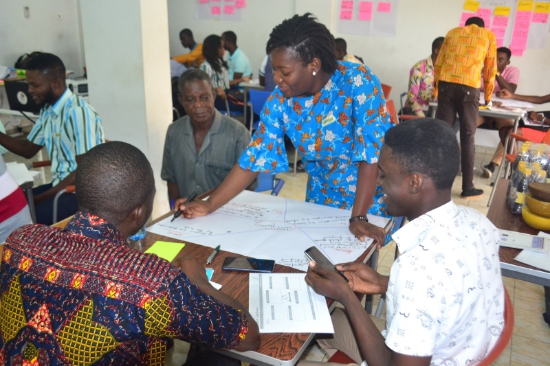 Rahina Sidiki Alare and other group members developing a customer empathy map of their proposed businesses